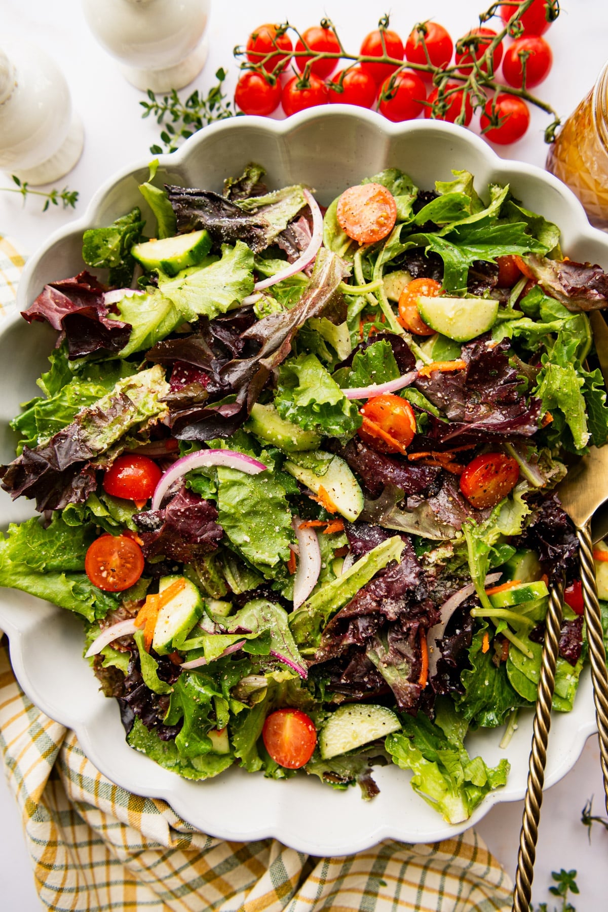 Close overhead shot of a side salad in a white bowl.