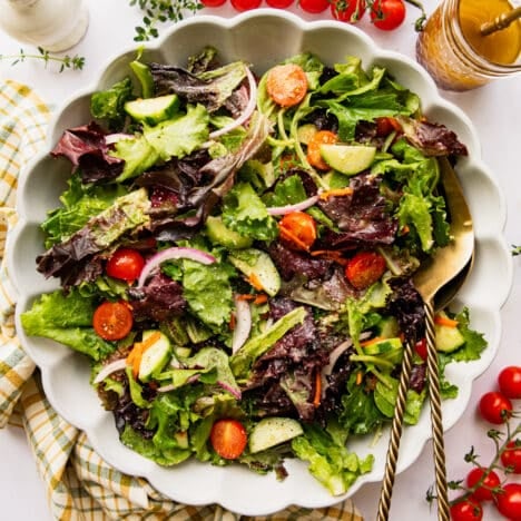 Square overhead shot of a side salad in a white bowl.
