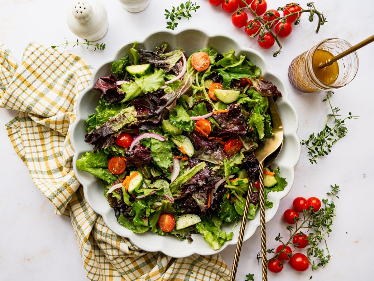 Horizontal overhead shot of a side salad in a white bowl.