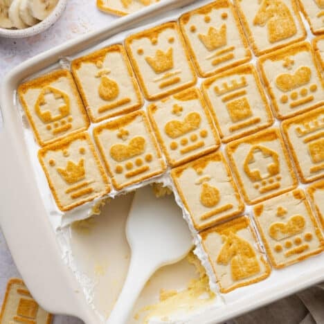 Overhead shot of a pan of chessman banana pudding with a few servings taken out.