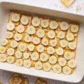 A layer of sliced bananas on top of the cookies.