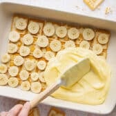 Spreading the vanilla pudding layer.