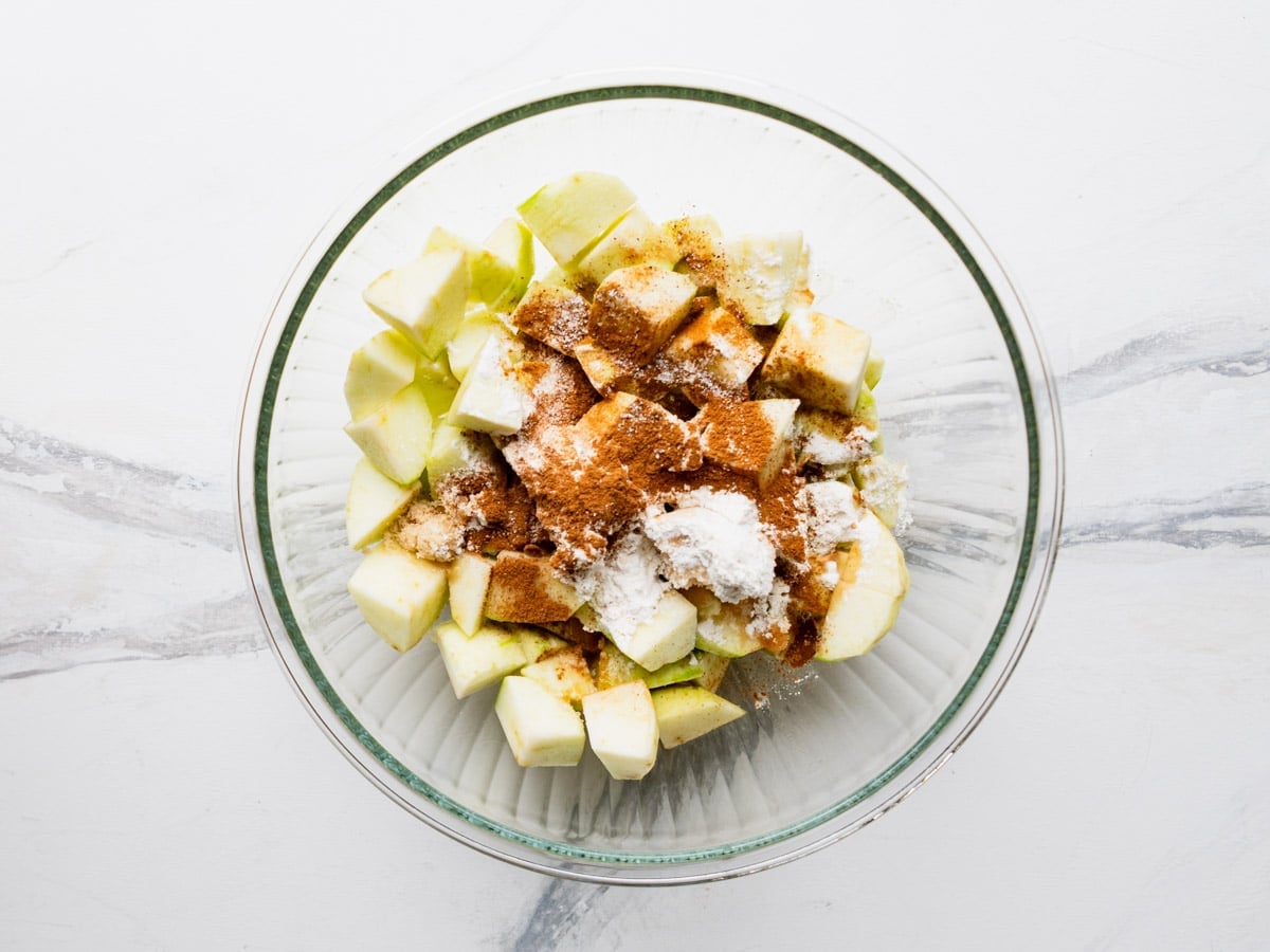 Apple filling ingredients in a glass bowl.