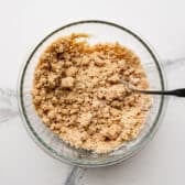 Stirring together the crumble topping.