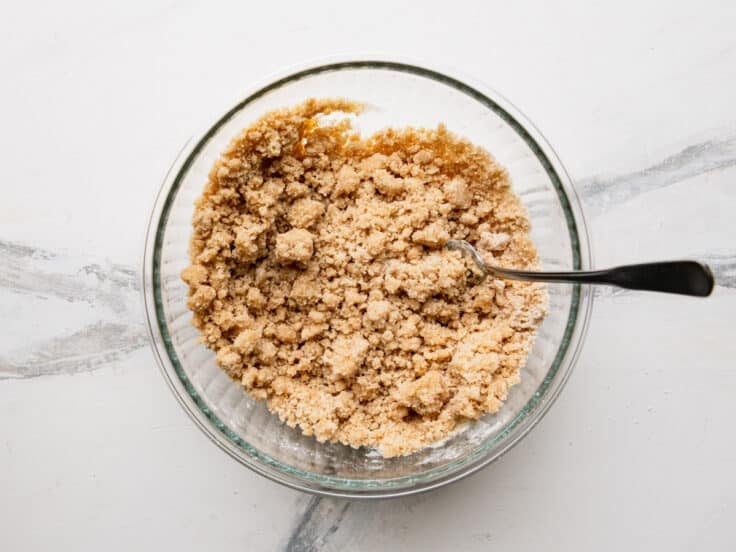 Stirring together the crumble topping.