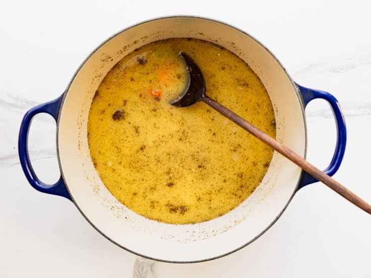 Adding the seasoning to the pot.