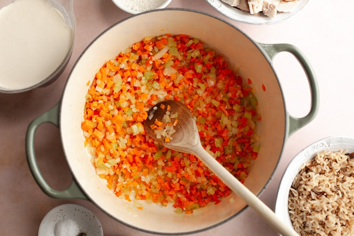 Sauteing the vegetables in a Dutch oven.