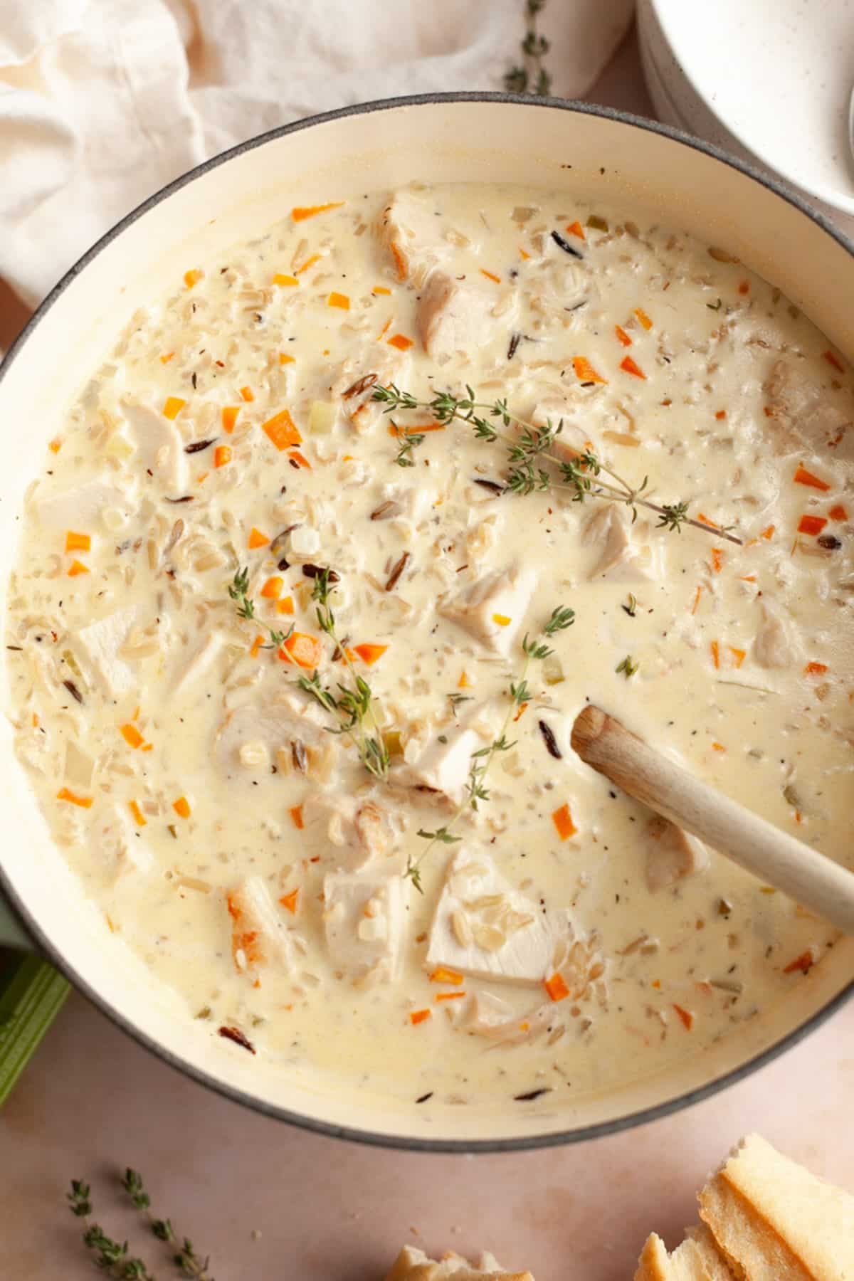 Overhead image of creamy chicken and wild rice soup in a Dutch oven.