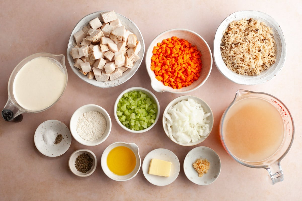 Ingredients for a creamy chicken and wild rice soup recipe.