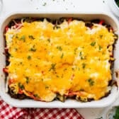 Horizontal overhead image of a John Wayne casserole baked in a white dish.