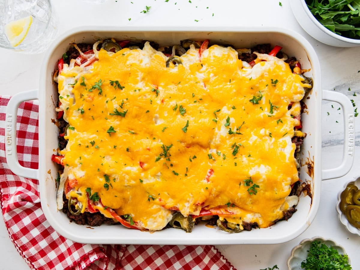 Horizontal overhead image of a John Wayne casserole baked in a white dish.