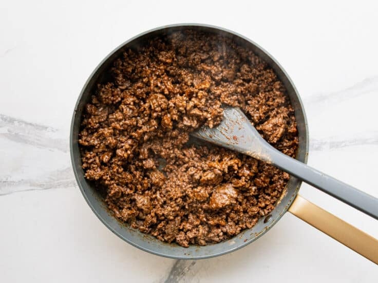 Cooked ground beef taco meat in a skillet.