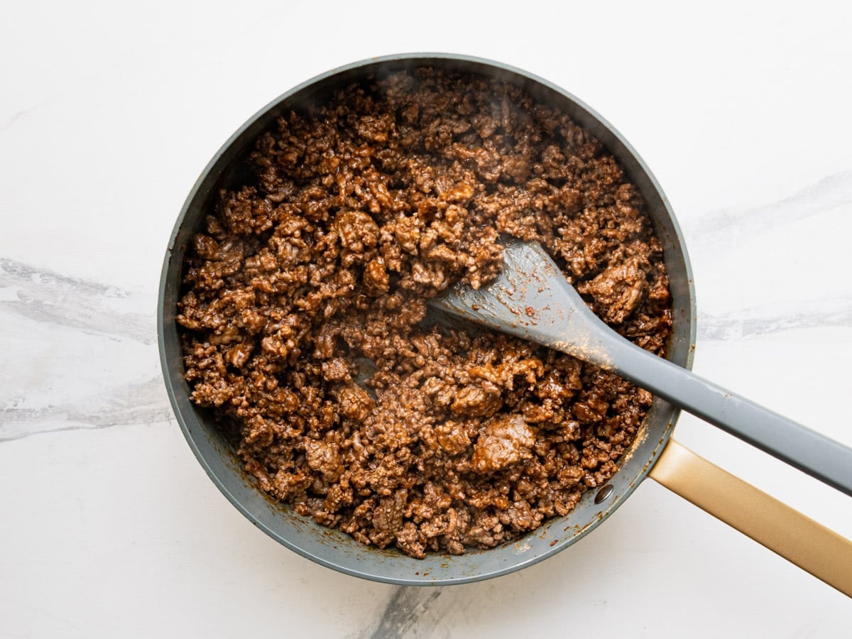 Cooked ground beef taco meat in a skillet.