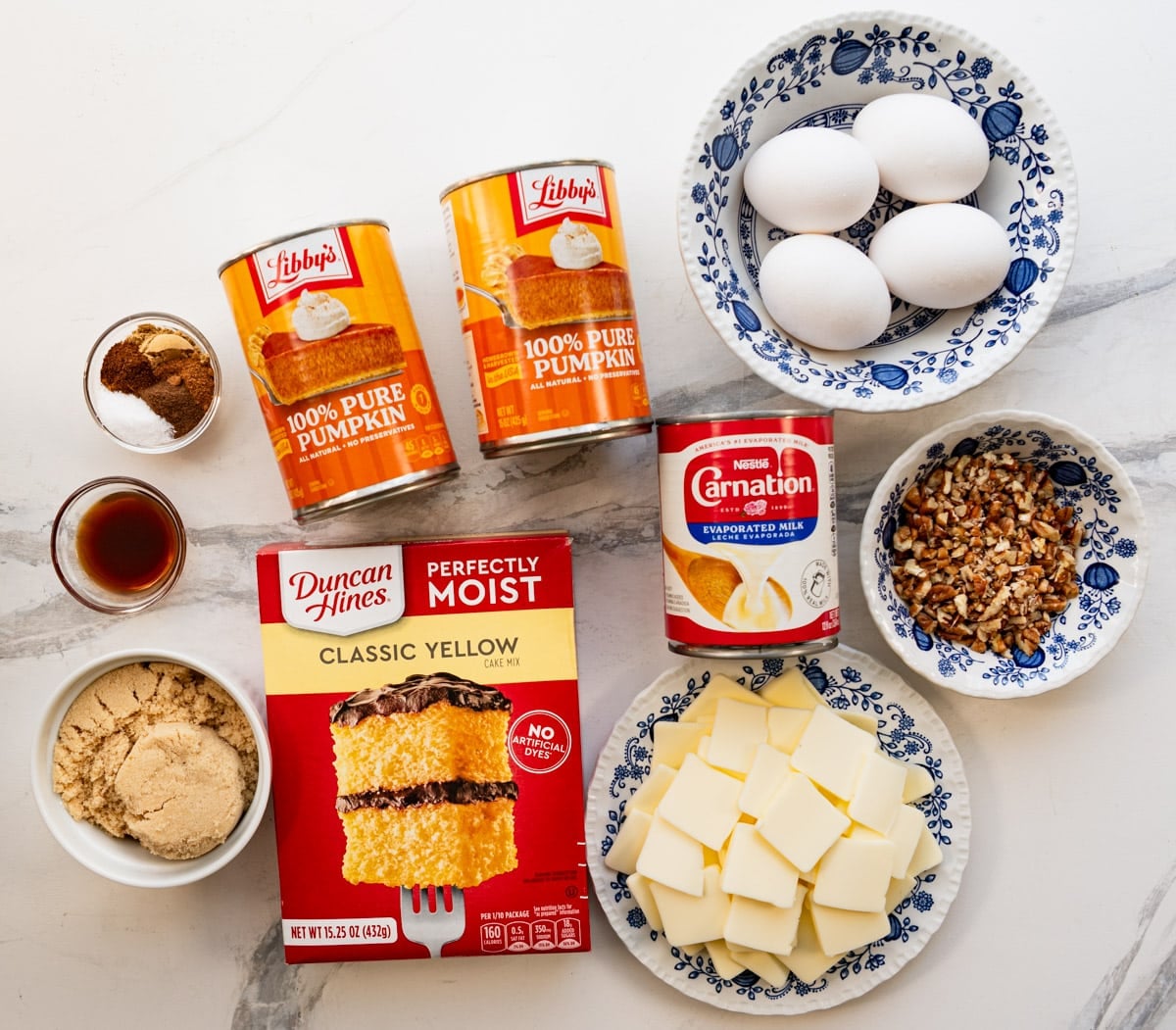 Ingredients for a pumpkin dump cake recipe.