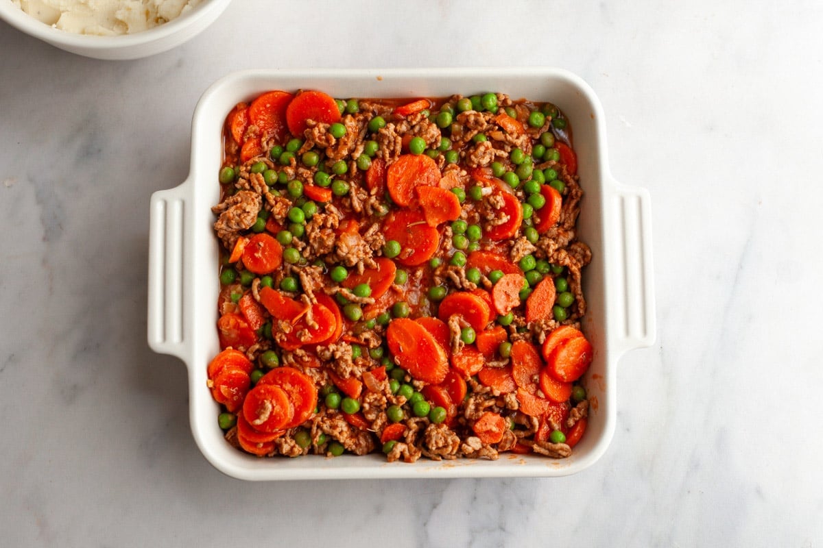 Arranging the filling in a baking dish.