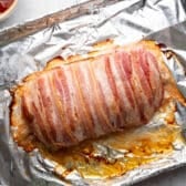 Bacon wrapped meatloaf after its first time in the oven.