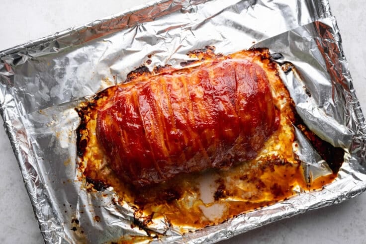 Bacon wrapped meatloaf after broiling.