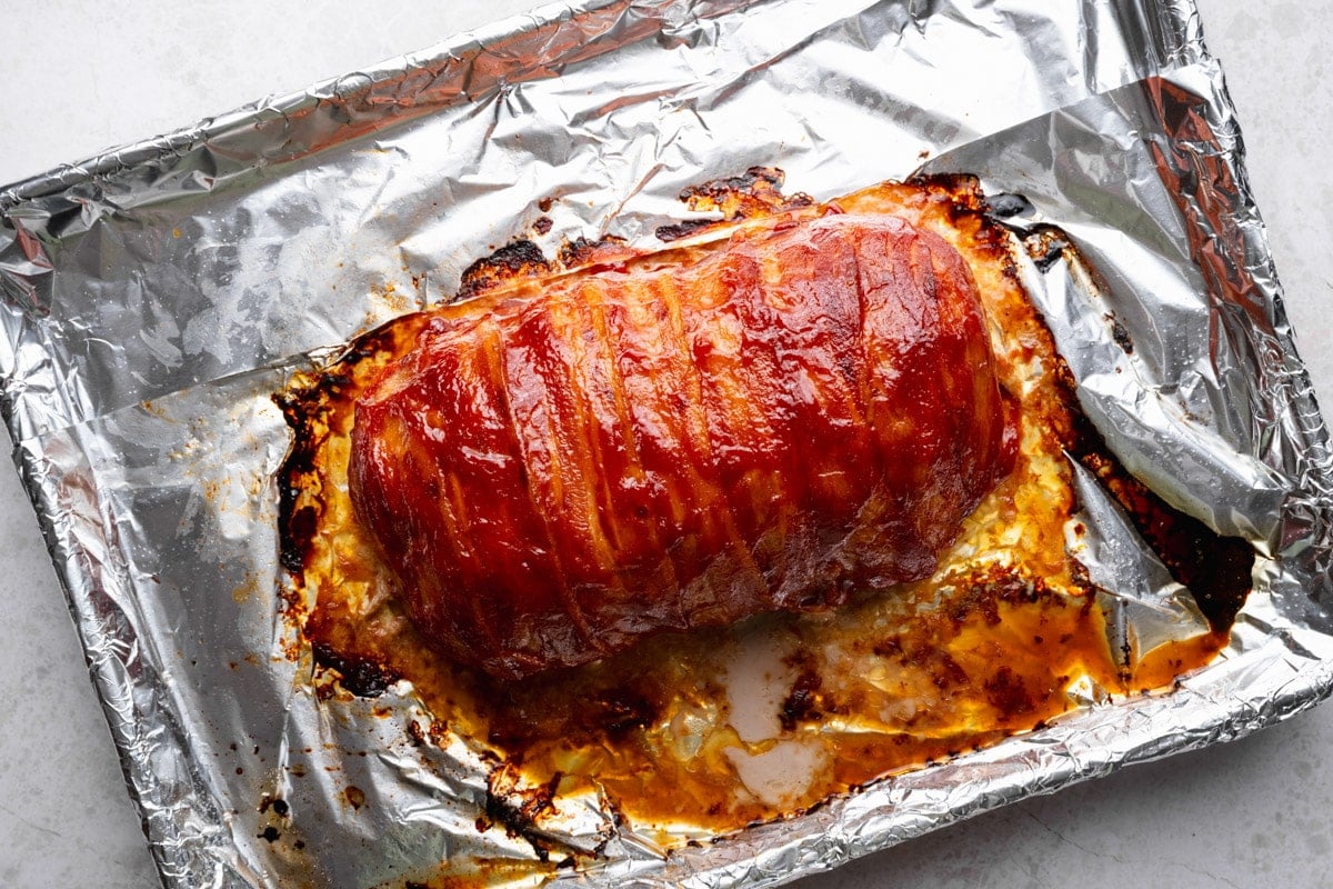 Bacon wrapped meatloaf after broiling.